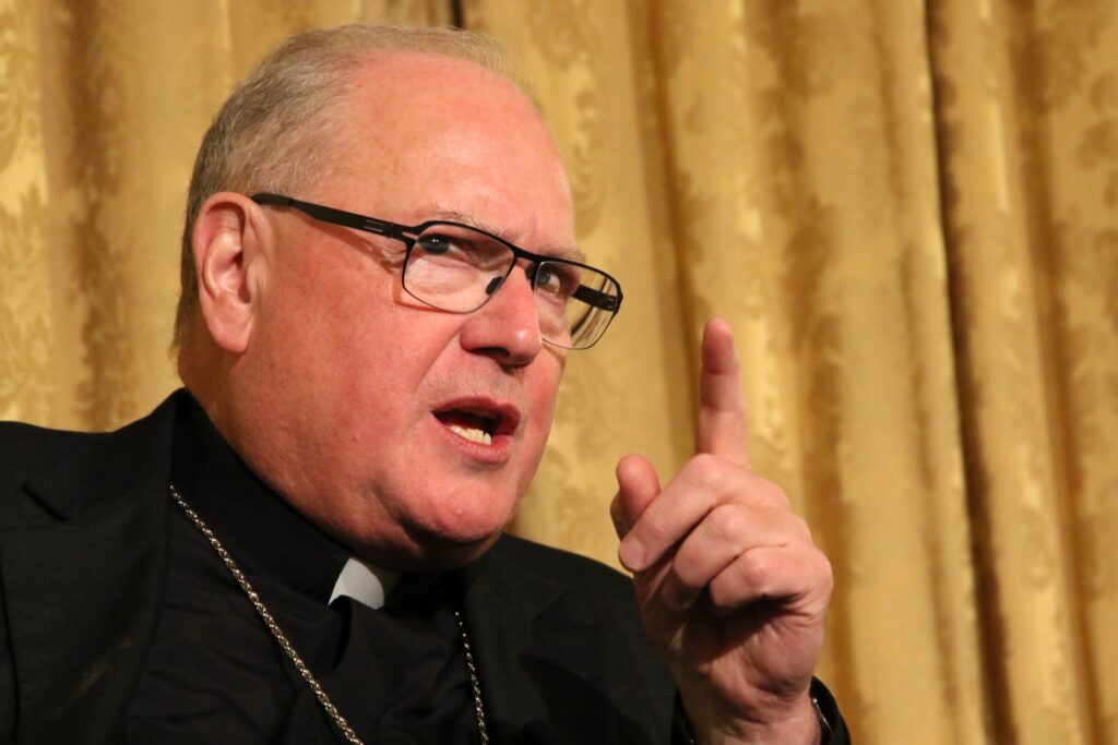 New York Cardinal Timothy M. Dolan gestures as he speaks during a conference, Dec. 5, 2017.