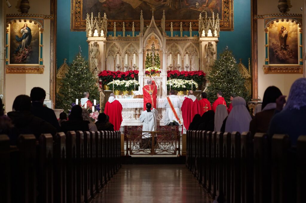 The photo depicts New York Auxiliary Bishop Peter J. Byrne celebrating a Mass to mark the feast of the Holy Innocents on December 28, 2020.