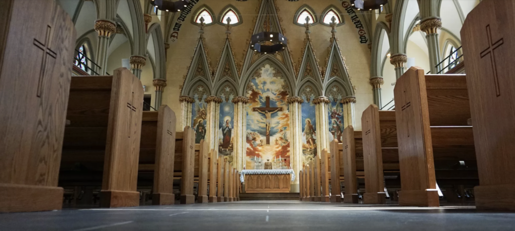 A wide shot of the pews and altar at Saint Brigid-Saint Emeric’s Parish in Manhattan.
