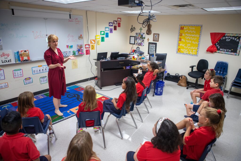 Megan Miller, a music teacher and orchestra director, teaches during an Aug. 12, 2019, class session at St. Mary Catholic School in League City, Texas.
