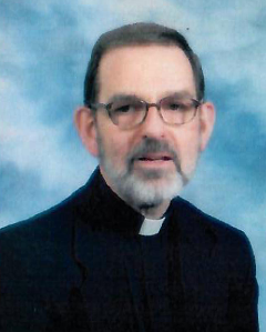 A still photo of Reverend Father Karl A. Bauer, who died on December 31, 2022.