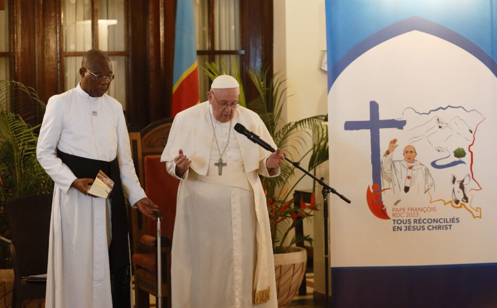 Pope Francis prays as he meets with representatives of charities in Kinshasa, Congo, Feb. 1, 2023.
