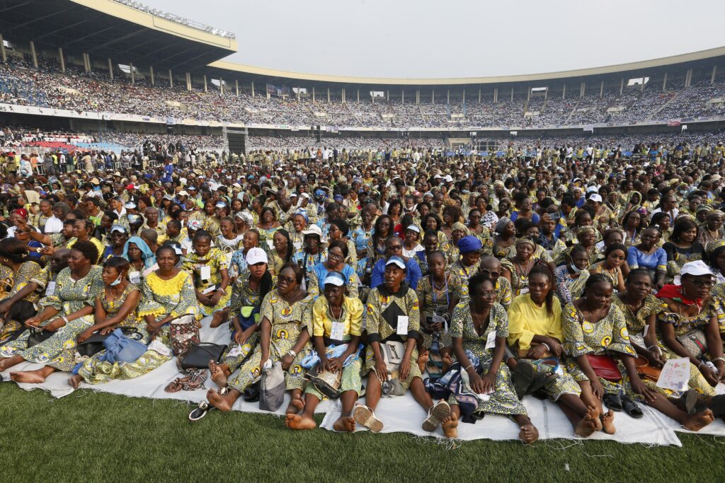 People wait for Pope Francis' arrival for a meeting with young people and catechists in Martyrs' Stadium in Kinshasa, Congo, Feb. 2, 2023.