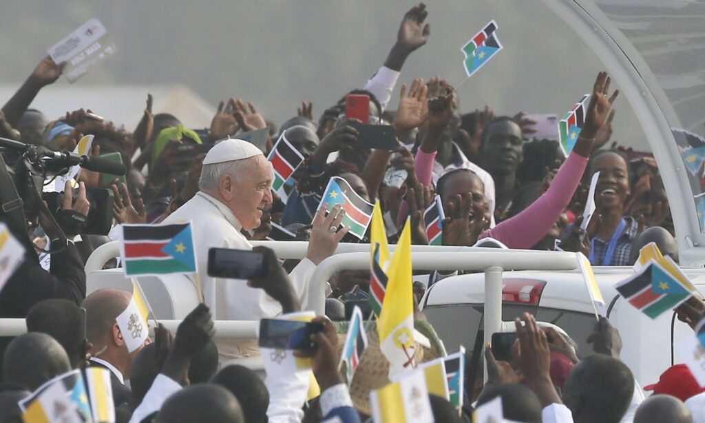 Pope Francis greets the crowd as he arrives to celebrate Mass at the John Garang Mausoleum in Juba, South Sudan, Feb. 5, 2023.