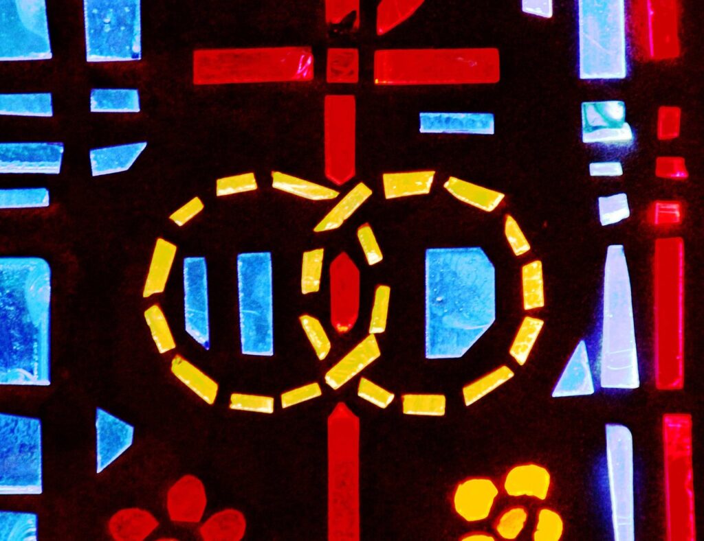 A pair of wedding bands symbolizing the sacrament of marriage is depicted in a stained-glass window at St. Isabel Church in Sanibel, Fla.