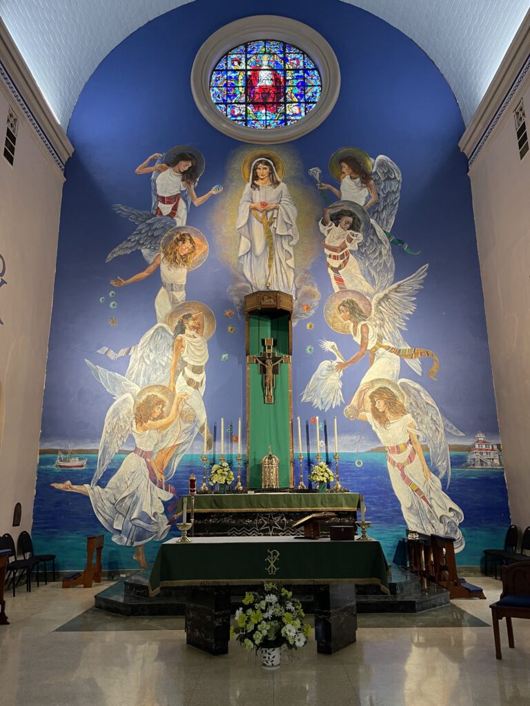 A mural known as "Dance of Holy Innocents" is pictured in the sanctuary of Our Lady Star of the Sea Catholic Church in New Orleans Sept. 16, 2022. 