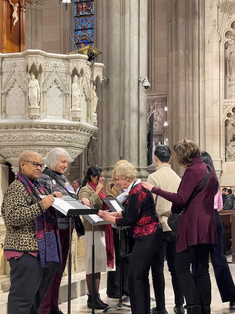 Catechumens sign pages that were later added to the Book of the Elect.