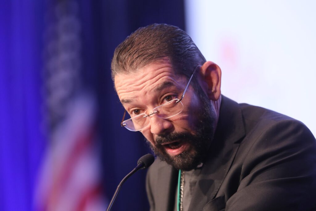 Bishop Daniel E. Flores of Brownsville, Texas, speaks during a Nov. 17, 2021, session of the fall general assembly of the U.S. Conference of Catholic Bishops in Baltimore.