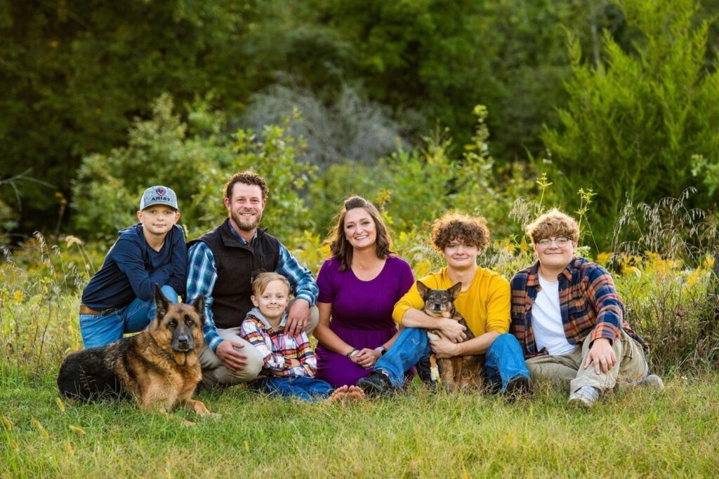 Josh and Anna Launius and their four sons gather for a family photo.