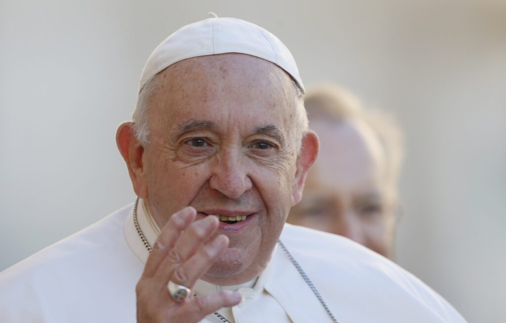 Pope Francis greets the crowd as he arrives for his general audience in St. Peter's Square at the Vatican Oct. 5, 2022.