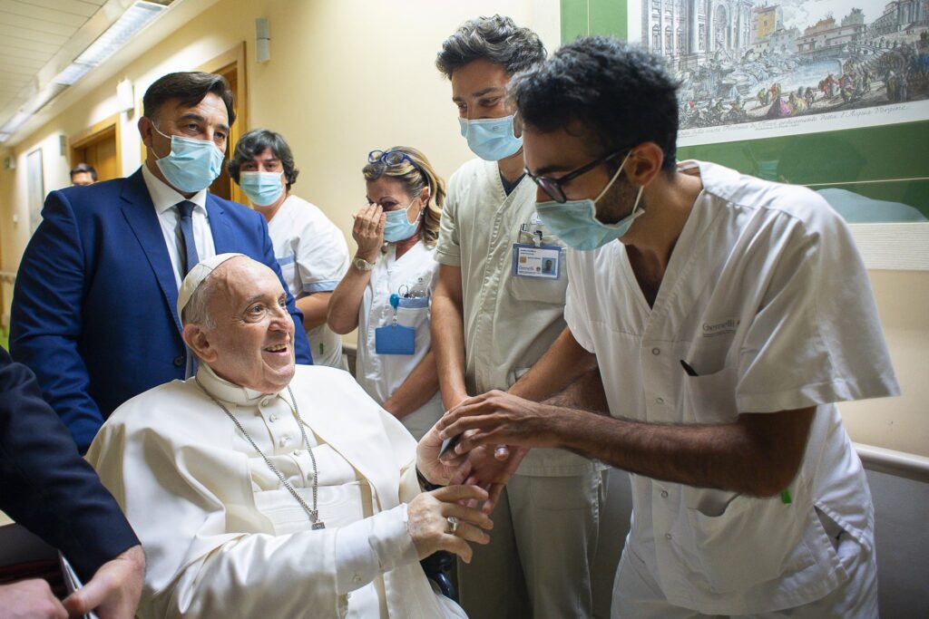 Pope Francis greets hospital workers at Gemelli hospital in this file photo taken in Rome July 11, 2021, when the pope had been in the hospital for 10 days to recover from scheduled colon surgery.
