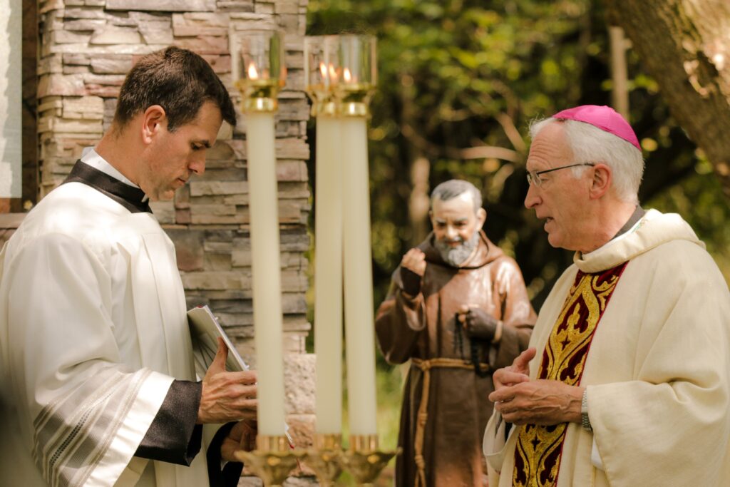 Bishop Earl A. Boyea Jr. (right) of Lansing, Mich., celebrates a Sept. 23, 2020, Mass during the dedication of 40 acres of land in Howell, Mich., donated for the planned "Casa USA" project.