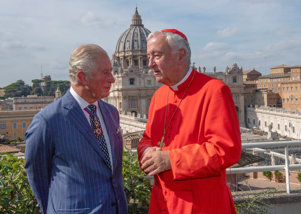 Then-Prince Charles of Britain and Cardinal Vincent Nichols of Westminster, England, chat during a reception at the Pontifical Urbanian University in Rome, Oct. 13, 2019, the day of the canonization of St. John Henry Newman and four others.