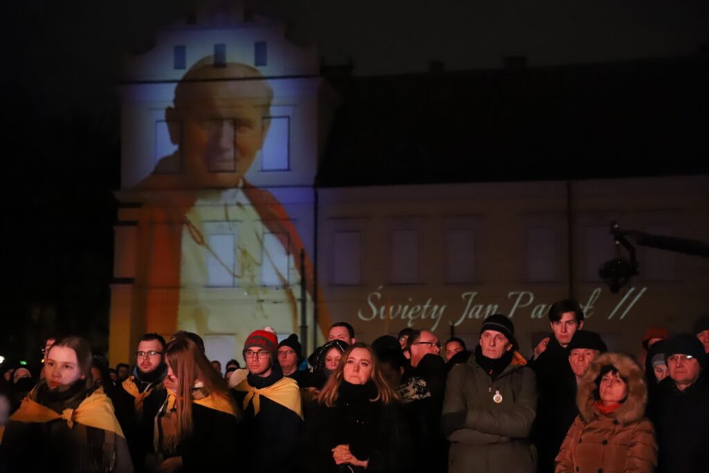 The faithful gather in front of the Bishops' Palace in Krakow, Poland, on Franciszkanska Street on April 2, 2023. Cardinal Karol Wojtyla lived there as Archbishop of Krakow and as Pope John Paul II, he used to have informal meetings there with the faithful at the so-called "Papal Window."