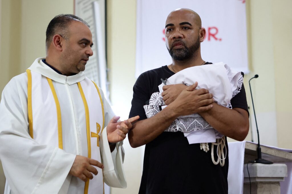 Father Luis Estevez chats with Claretian Father Donaciano Alarcón of Panama at the Cathedral of St. Peter the Apostle in San Pedro Sula, Honduras, April 5, 2023.