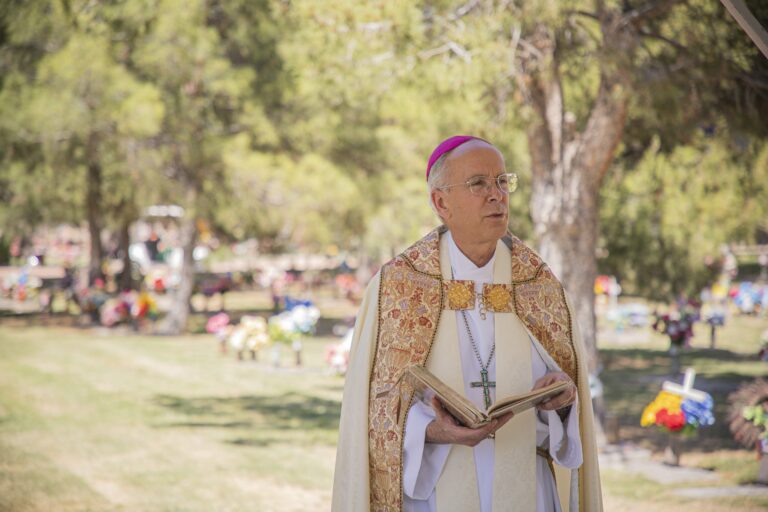 Bishop Mark J. Seitz of El Paso, Texas, takes part in a burial ceremony April 29, 2020, at Our Lady of Mount Carmel Cemetery in El Paso of unclaimed cremated remains that were in possession of a probate lawyer.
