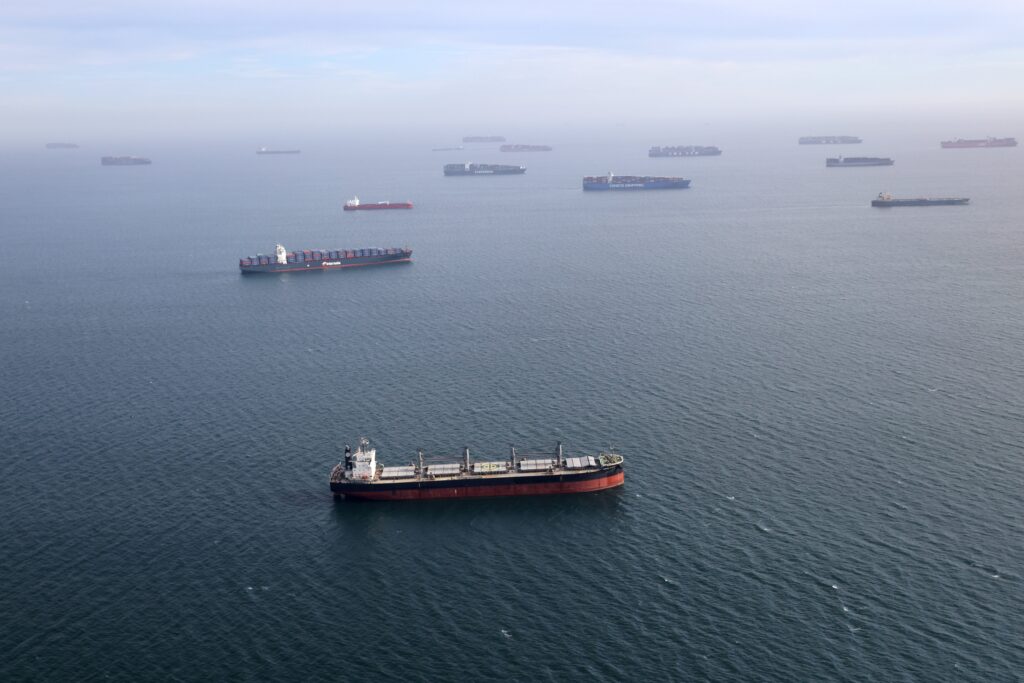 Container ships and oil tankers are seen outside the Port of Long Beach-Port of Los Angeles complex on April 7, 2021, amid the coronavirus pandemic.