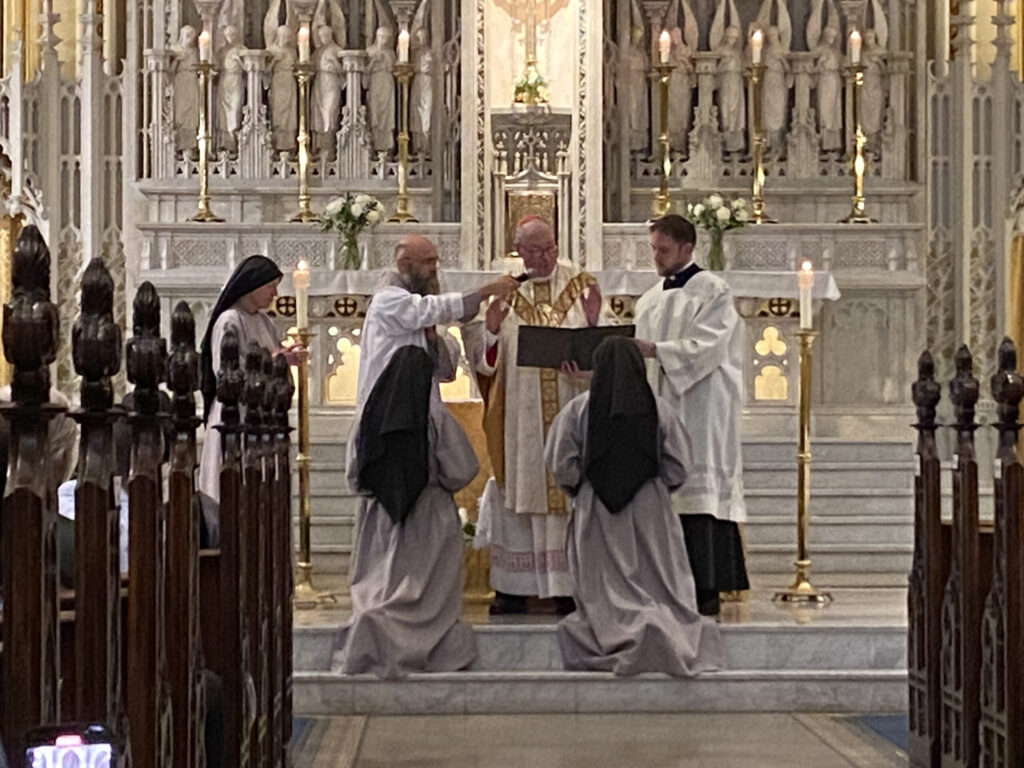 Two sisters of the Franciscan Sisters of the Renewal take their final vows at Our Lady of Good Counsel in Manhattan at their final vows Mass, May 13, 2023.