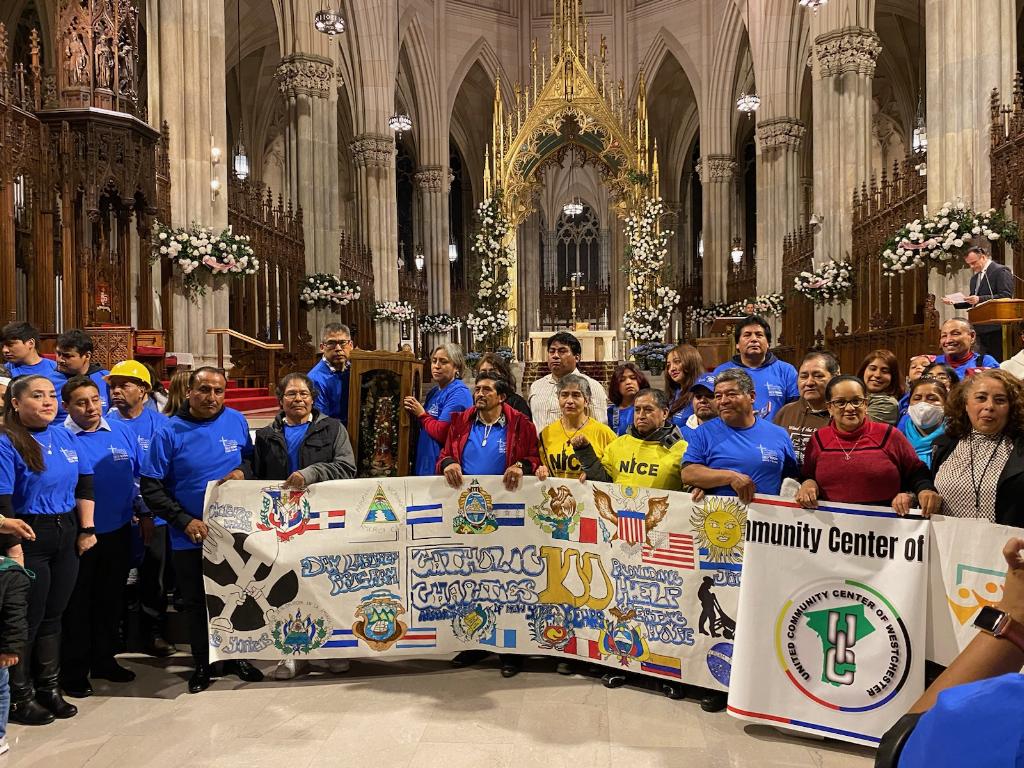 Day laborers gather after Mass at St. Patrick's Cathedral, April 30, 2023.