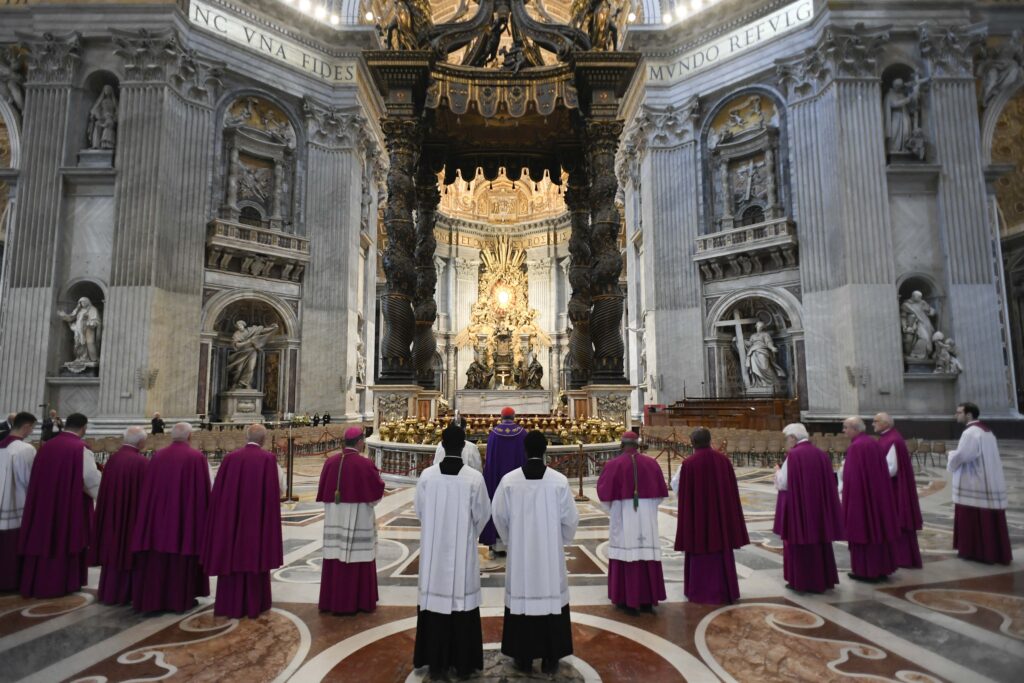 Cardinal Mauro Gambetti, archpriest of St. Peter's Basilica, and priests belonging to the basilica chapter make an act of reparation before the main altar of the basilica at the Vatican June 3, 2023, after a man climbed on the altar naked.