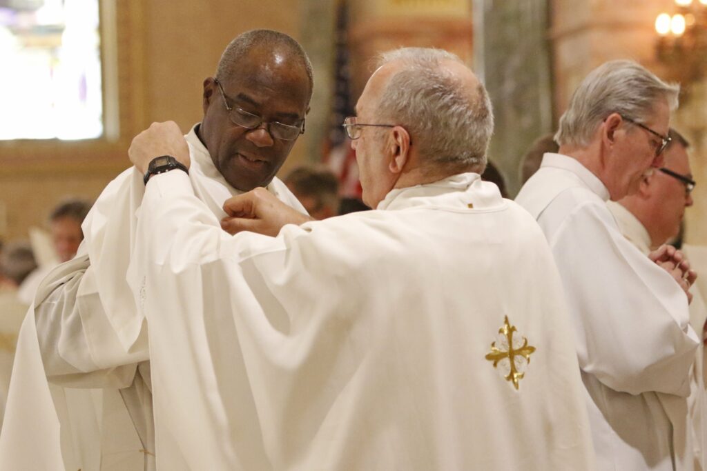 Deacon Francis Cuffie is vested by Msgr. Joseph Malagreca during his ordination to the diaconate at St. Joseph Co-Cathedral in Brooklyn, N.Y., May 25, 2019.