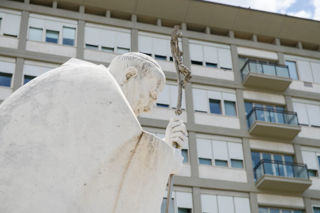 A statue of St. John Paul II is seen outside of Rome's Gemelli hospital June 10, 2023, where Pope Francis is staying after undergoing surgery to treat a hernia June 7.