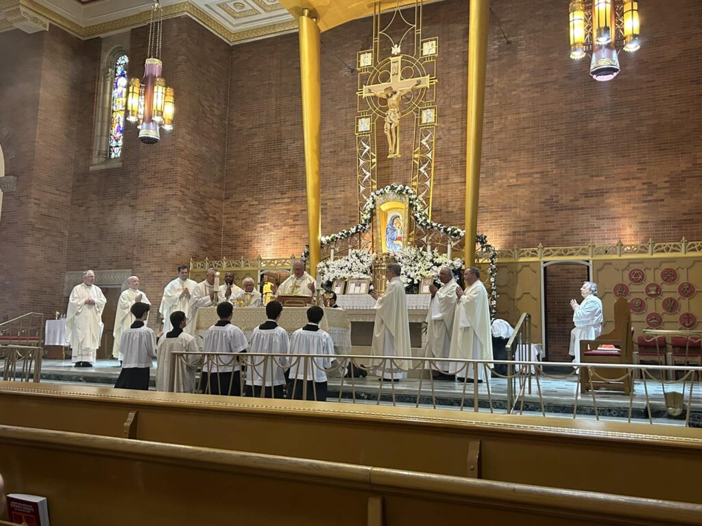 Cardinal Timothy Dolan (center) celebrates Mass at the Church of St. Benedict in the Bronx, June 10, 2023.