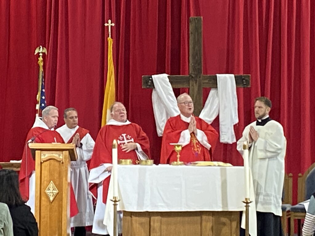 Cardinal Timothy Dolan (center right) celebrates Mass at Iona University's Hynes Athletic Center in New Rochelle, June 5, 2023.