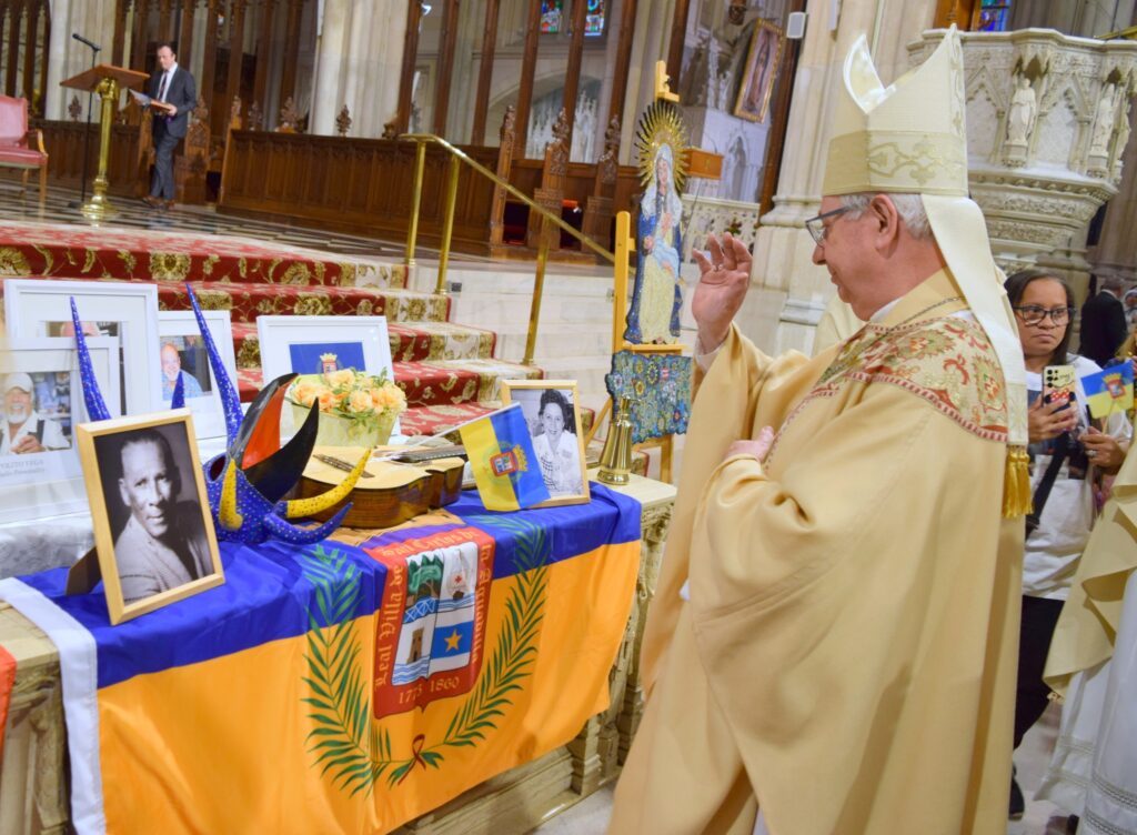 Bishop Luis Miguel Romero Fernández, M.Id, Auxiliary Bishop of the Diocese of Rockville Center blessing items placed by the altar during the Puerto Rican Day Parade Mass, June 4, 2023, at St. Patrick's Cathedral.