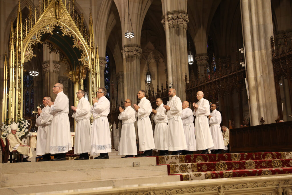 Permanent deacons being ordained process on the altar of St. Patrick's Cathedral, June 17, 2023.