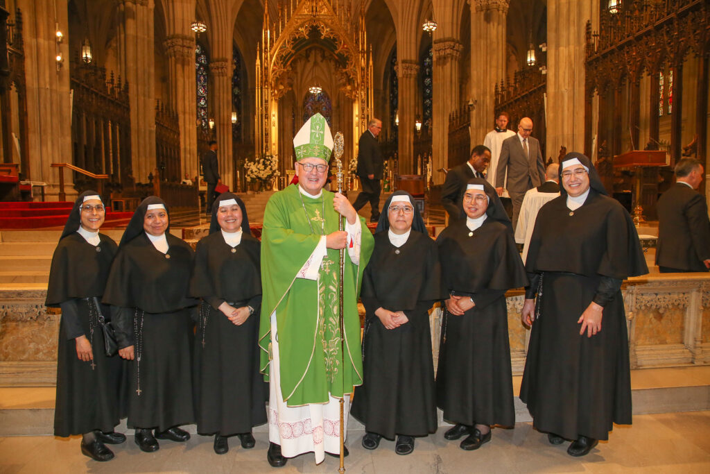 Religious sisters celebrating their jubilees pose with Cardinal Timothy Dolan (center) at St. Patrick's Cathedral, June 18, 2023.