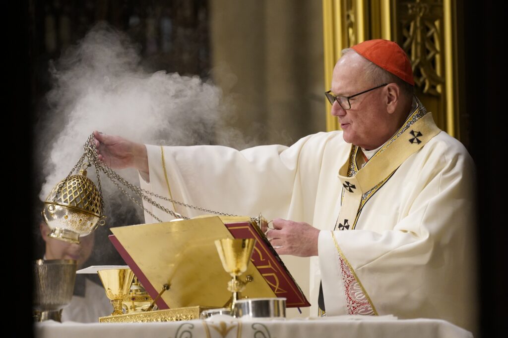 New York Cardinal Timothy M. Dolan uses a censer while celebrating the St. Patrick's Day Mass at St. Patrick's Cathedral in New York City March 17, 2023.