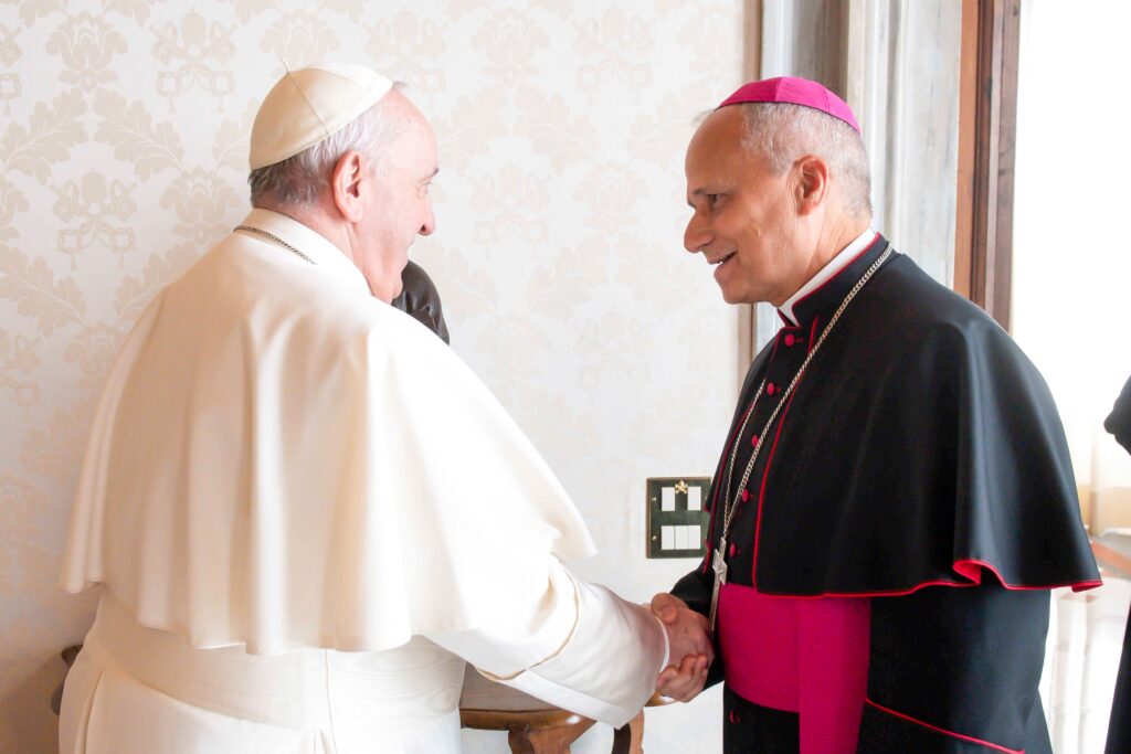 Pope Francis greets Archbishop Robert F. Prevost, a Chicago native, during a private audience at the Vatican Feb. 12, 2022.
