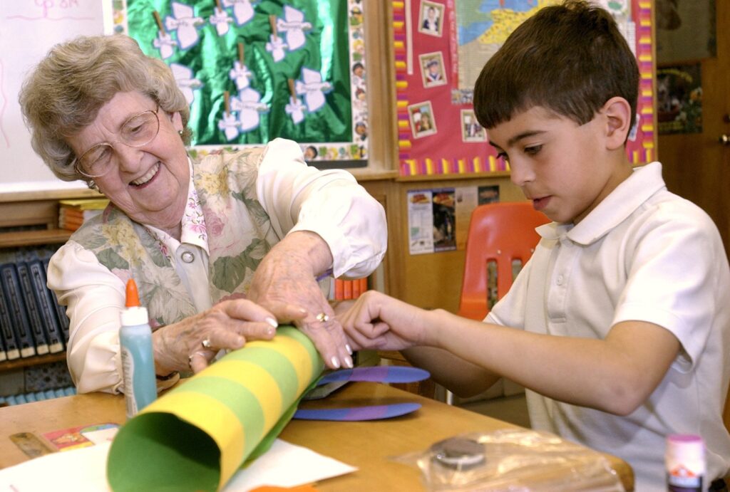 Helen Lou Barden of Dansville, N.Y., and her grandson, fourth-grader Brett Barden, work together to construct a paper dragonfly in this file photo from April, 2005.