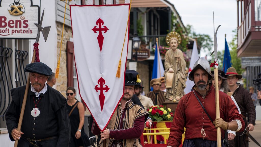 Pilgrims join in a procession in downtown St. Augustine, Fla., taking a statute of St. James (the Apostle Santiago) from the Castillo de San Marcos, a Spanish-built masonry fort dating to the late 1600s, to its new home in the Cathedral Basilica of St. Augustine a few blocks away July 25, 2023.