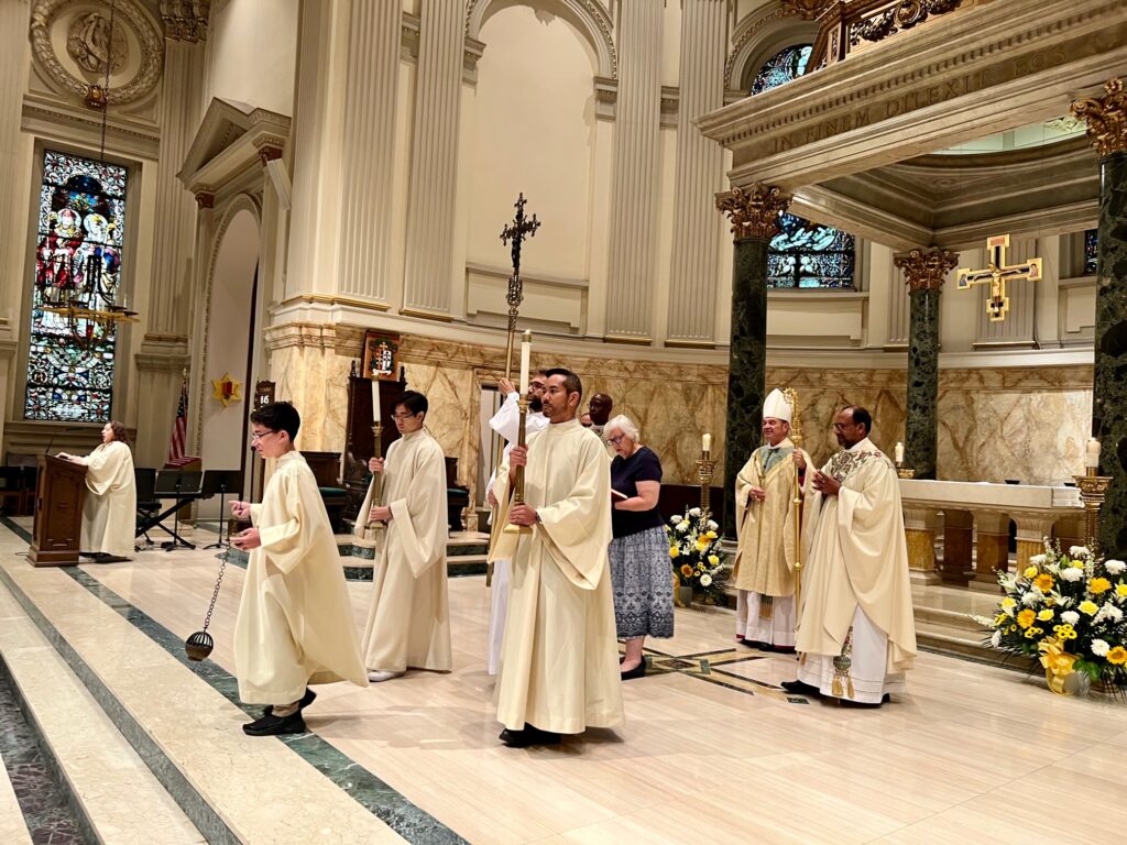 Diocese of Brooklyn Bishop Robert Brennan and concelebrating priests process out at the conclusion of Cathedral Basilica of St. James's bicentennial Mass, August 28, 2023.