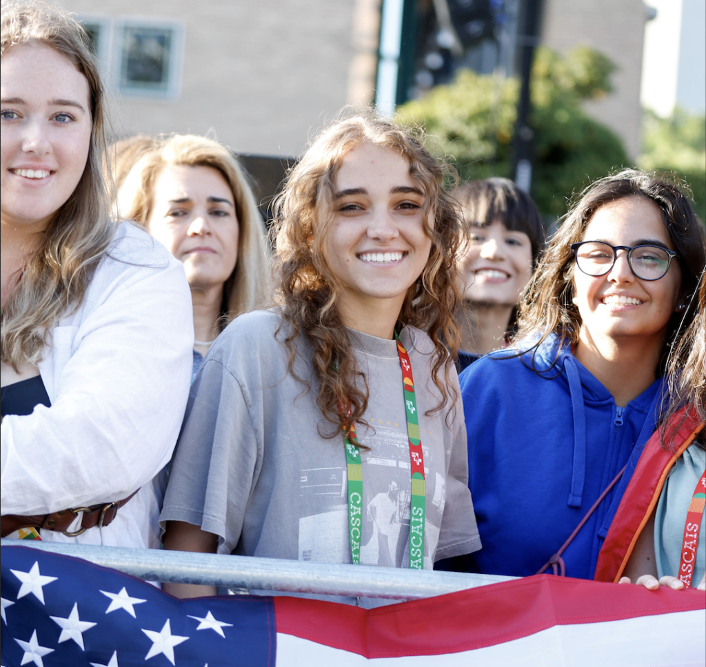 Carine Milne, a 19-year-old college student at Purdue University Northwest, waits for Pope Francis to arrive at his meeting with university students at the Catholic University of Portugal in Lisbon, Portugal, Aug. 3, 2023.