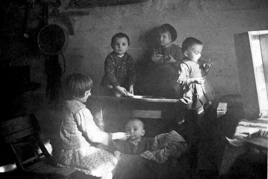 Five of the Ulma family children are pictured in an undated photo feeding each other in their house in Markowa, Poland.