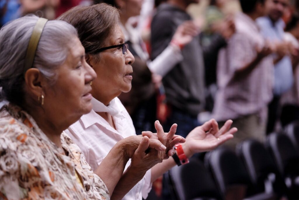 Parishioners are pictured in a file photo praying during Mass at the Hispanic Charismatic Congress of the Diocese of Sioux City, Iowa.