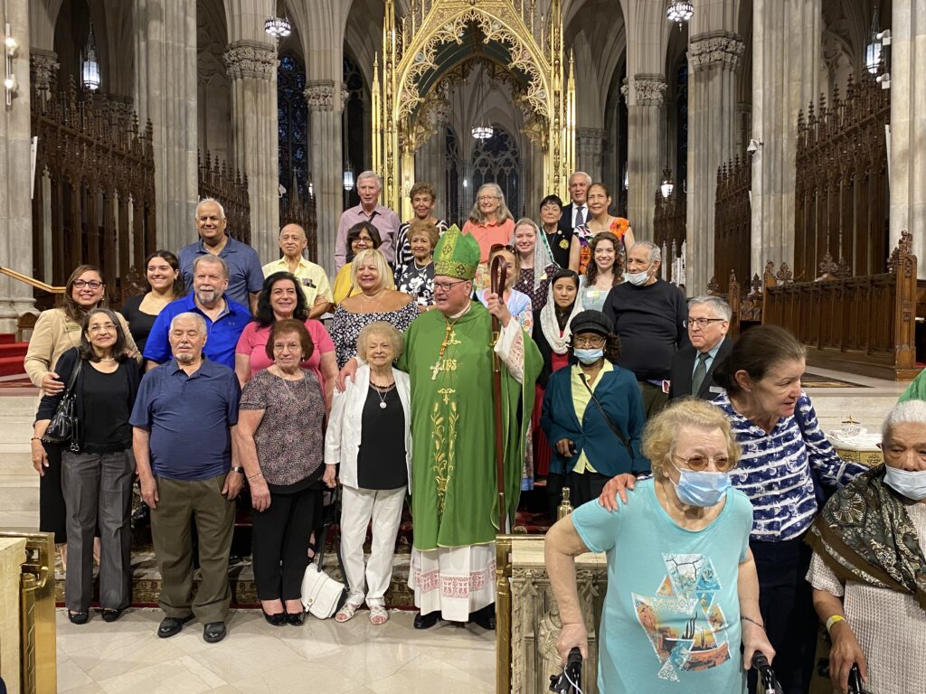 Grandparents from the Archdiocese of New York and beyond gather with Cardinal Timothy Dolan (center, green vestments) after a Mass celebrating grandparents and the elderly at St. Patrick's Cathedral, September 10, 2023.