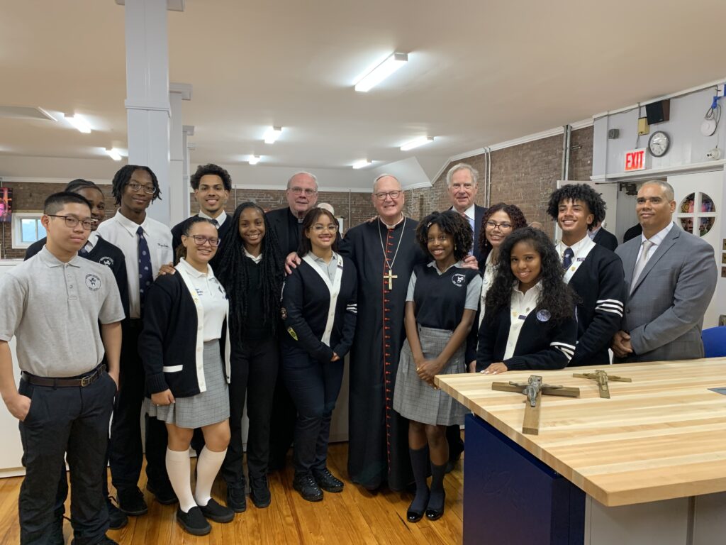 Cardinal Dolan with Scanlan students, Monsignor Dennis Keane, Board Member, Chris Gallagher, Board Chair, and Eric Mercado, Principal, in the new Zolfo STEM Center at Monsignor Scanlan High School.