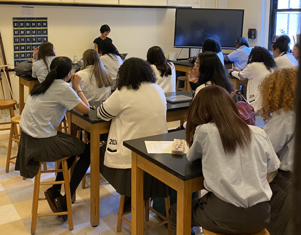 A Cathedral High School teacher gets her class set up for the new academic year, as the school holds its first classes in its new address on 97th Street.