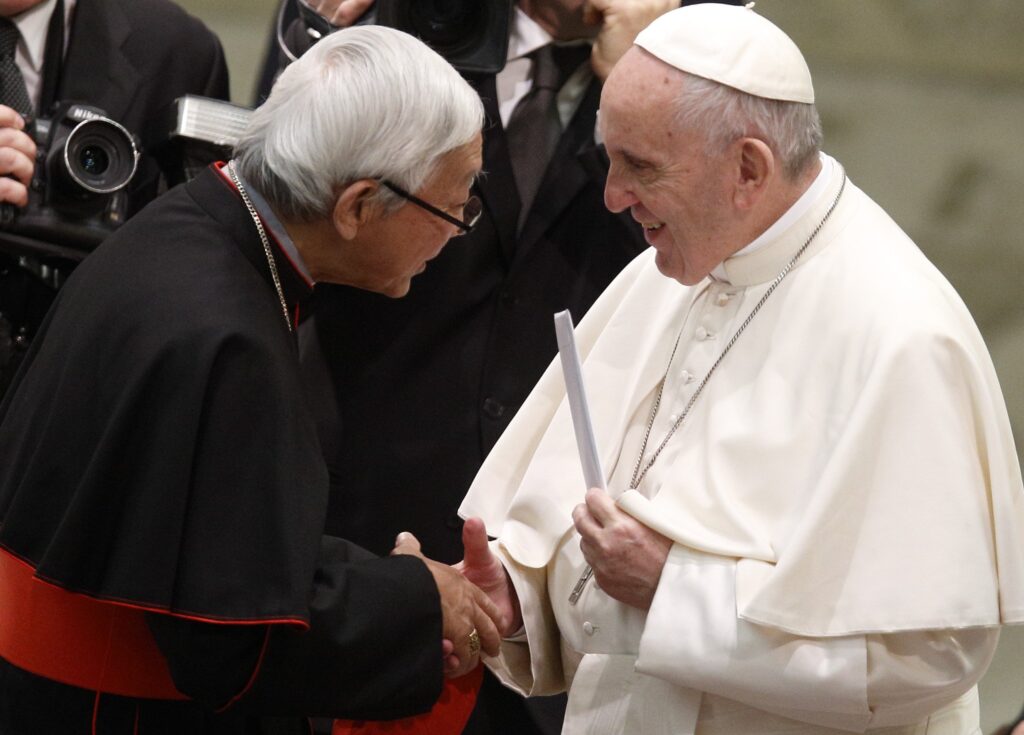 Pope Francis holds a letter presented by Cardinal Joseph Zen, retired bishop of Hong Kong, during his general audience in 2018 at the Vatican.