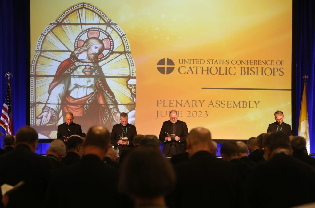 Bishops pray during morning prayer on June 15, 2023, at the U.S. Conference of Catholic Bishops' spring plenary assembly in Orlando, Florida.