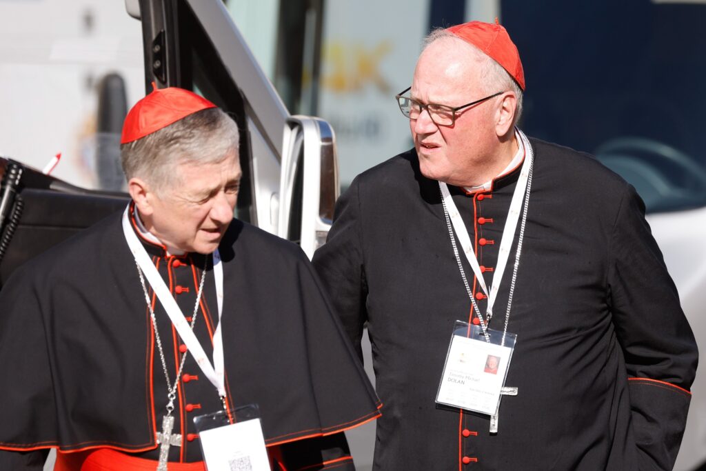 Cardinal Blase J. Cupich of Chicago and Cardinal Timothy M. Dolan of New York arrive for the first session of the assembly of the Synod of Bishops at the Vatican on October 4, 2023.