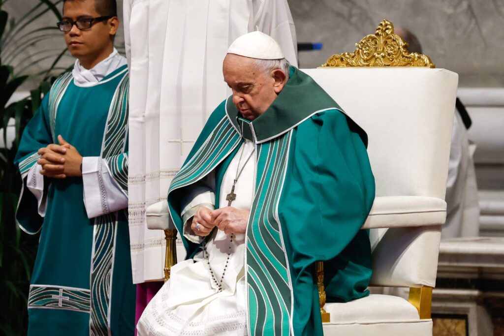 Pope Francis holds his rosary as he joins the congregation in prayer before presiding over a Mass in St. Peter's Basilica at the Vatican Oct. 29, 2023, marking the conclusion of the first session of the Synod of Bishops on synodality.