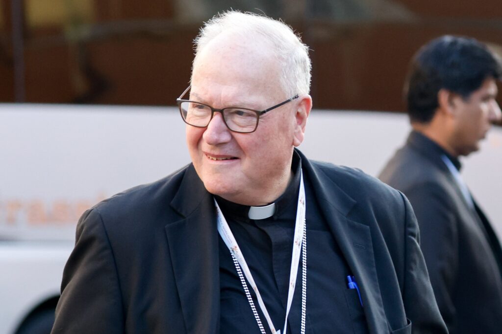 Cardinal Timothy M. Dolan of New York arrives for a working session of the assembly of the Synod of Bishops in the Vatican's Paul VI Audience Hall on October 26, 2023.