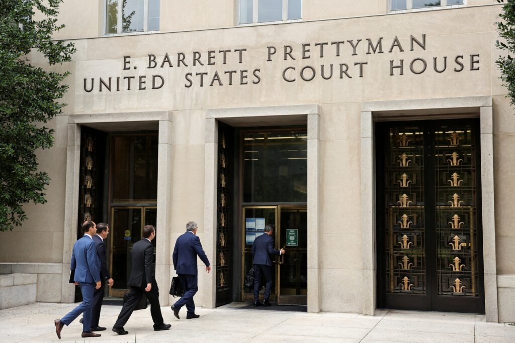 Attorneys arrive at the U.S. District Court for the District of Columbia in Washington in this file photo from August 28, 2023.