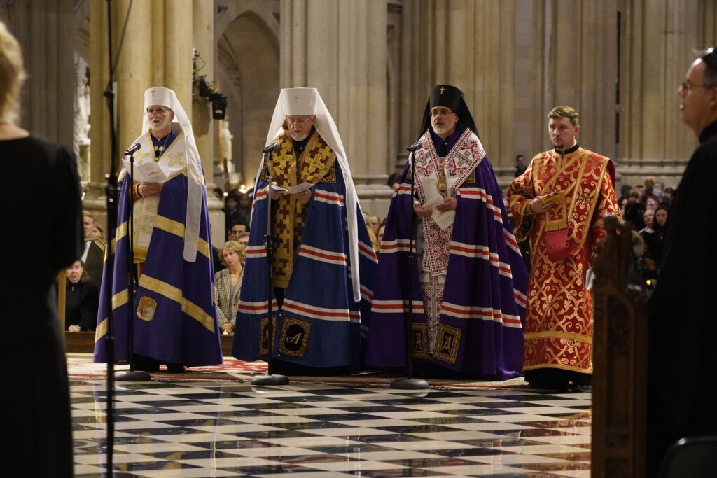 Metropolitan Archbishop Borys A. Gudziak of the Ukrainian Catholic Archeparchy of Philadelphia, left, Metropolitan Antony and Archbishop Daniel, both of the Ukrainian Orthodox Church of the USA, and an unidentified cleric pray at St. Patrick's Cathedral in New York City Nov. 18, 2023, during a prayer service marking the 90th anniversary of the Holodomor, a famine engineered by Soviet dictator Josef Stalin that led to the deaths of millions of Ukrainians.