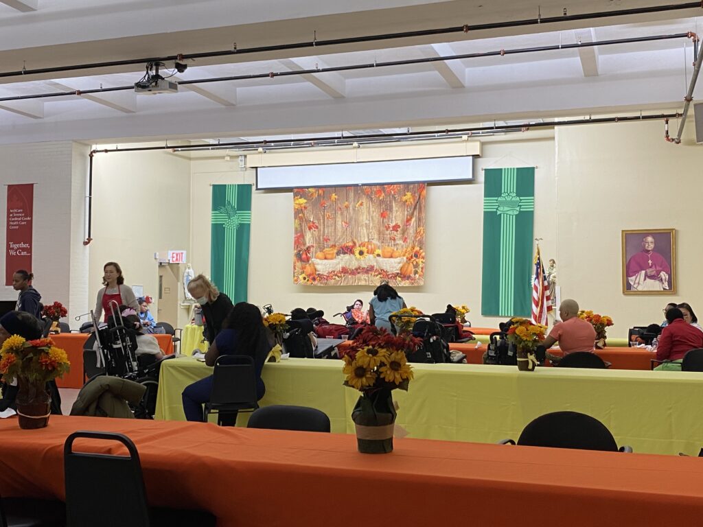 Patients, families, staff, and volunteers gathered for a Thanksgiving celebration at ArchCare's Terence Cardinal Cooke Healthcare Center, November 21, 2023.